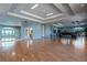The community room is spacious, with windows overlooking a lake and other amenities, such as a dance studio at 2359 Baronsmede Ct, Winter Garden, FL 34787
