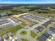 An aerial view captures community with cul-de-sac and green spaces among the modern homes at 2372 Orchid Dr, Davenport, FL 33837