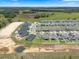 An aerial view shows a Primary-planned community in a serene setting with a large expanse of green space at 2372 Orchid Dr, Davenport, FL 33837