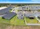 Home boasts lush green lawn and fenced yard; adjacent to a lot with a pond at 2372 Orchid Dr, Davenport, FL 33837