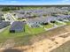 Aerial view featuring a two-story home with fenced yard, sitting adjacent to a vacant lot at 2372 Orchid Dr, Davenport, FL 33837