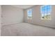 Bedroom featuring plush carpeting, neutral paint, and large windows for ample natural lighting at 2372 Orchid Dr, Davenport, FL 33837