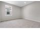 Bright bedroom with a large window and plush carpeting at 2372 Orchid Dr, Davenport, FL 33837
