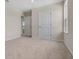 View of the bedroom with plush carpet, neutral walls, and ensuite access at 2372 Orchid Dr, Davenport, FL 33837