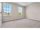 Bright bedroom with carpet flooring, neutral colored walls, and large window offering ample natural light at 2372 Orchid Dr, Davenport, FL 33837