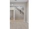 The entryway has tile floors that lead to a carpeted living space and staircase at 2372 Orchid Dr, Davenport, FL 33837
