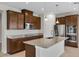 A modern kitchen features stainless steel appliances, granite countertops, and ample cabinetry at 2372 Orchid Dr, Davenport, FL 33837