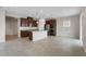 Open-concept kitchen with stainless steel appliances and a large island at 2372 Orchid Dr, Davenport, FL 33837