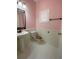 Powder room featuring hexagon tile flooring, white wainscoting, and a decorative wrought iron framed mirror at 2548 Galliano Cir, Winter Park, FL 32792