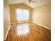 Bedroom with wood floors and a large window that provides natural light at 2548 Galliano Cir, Winter Park, FL 32792