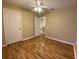 Bedroom featuring hardwood floors, a ceiling fan, and an adjoining closet space at 2548 Galliano Cir, Winter Park, FL 32792