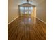 Bright bedroom with hardwood floors, a ceiling fan, plantation shutters, and neutral walls at 2548 Galliano Cir, Winter Park, FL 32792