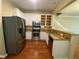 Modern kitchen with stainless steel appliances, granite countertops, and white cabinetry at 2548 Galliano Cir, Winter Park, FL 32792