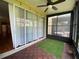 Enclosed lanai featuring tile-look flooring and sliding glass doors for easy access at 2548 Galliano Cir, Winter Park, FL 32792