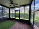 Enclosed lanai features wood-like flooring and views of the exterior yard at 2548 Galliano Cir, Winter Park, FL 32792