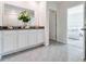 Bright bathroom features tiled flooring and a white vanity with double sinks at 2927 Elio Hammock Dr, St Cloud, FL 34773