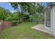Backyard with a patio, green grass, and mature trees at 3107 Ash Park Loop, Winter Park, FL 32792