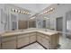 Bright bathroom featuring double sinks, large mirrors, and ample counter space at 3107 Ash Park Loop, Winter Park, FL 32792
