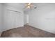 Clean, neutral bedroom with carpet, a ceiling fan, and double door closet space at 3107 Ash Park Loop, Winter Park, FL 32792