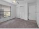 Cozy bedroom with carpet, a closet, and a window with blinds at 3107 Ash Park Loop, Winter Park, FL 32792