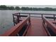 The dock features a wooden deck, railing, and a beautiful view of the lake at 3107 Ash Park Loop, Winter Park, FL 32792