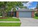 Charming single-Gathering home with a brick facade and mature landscaping in a well-maintained yard at 3107 Ash Park Loop, Winter Park, FL 32792