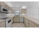 Functional kitchen with bright cabinets, modern appliances, and efficient design for easy cooking at 3107 Ash Park Loop, Winter Park, FL 32792