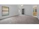 Spacious main bedroom with carpet, a window, and a door leading to ensuite bathroom at 3107 Ash Park Loop, Winter Park, FL 32792