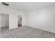 Neutral bedroom with carpeted floors, a walk-in closet, and an ensuite bathroom at 3144 Suraj Cir, Tavares, FL 32778