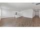 Open-concept living room and kitchen area with white walls and tile flooring at 3144 Suraj Cir, Tavares, FL 32778