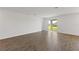 Bright, open living room features sliding glass doors to backyard and gorgeous tile flooring at 3144 Suraj Cir, Tavares, FL 32778