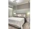 Elegant bedroom with stylish lighting, soft carpeting, and neutral decor at 3191 Paradox Cir # 102, Kissimmee, FL 34746