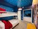 Toy Story themed room featuring a white bunkbed and TV with built-ins at 3191 Paradox Cir # 102, Kissimmee, FL 34746