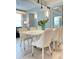 Elegant dining room featuring a modern table with seating for six guests at 3191 Paradox Cir # 102, Kissimmee, FL 34746