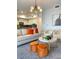 Open living room and kitchen area featuring modern furniture and stylish decor at 3191 Paradox Cir # 102, Kissimmee, FL 34746