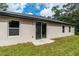 Backyard featuring a covered patio and sliding glass doors at 327 Larch Rd, Ocala, FL 34480
