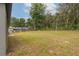 Expansive backyard with an enclosed pool area, providing space for recreation and relaxation at 327 Larch Rd, Ocala, FL 34480