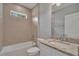 Cozy bathroom featuring a shower over tub and granite vanity at 327 Larch Rd, Ocala, FL 34480