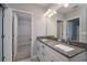 Bathroom featuring dual sinks and spacious walk-in closet at 327 Larch Rd, Ocala, FL 34480