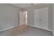 Neutral bedroom features carpeted floors and a closet for storage at 327 Larch Rd, Ocala, FL 34480