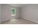 Neutral bedroom featuring carpeted floors and a window providing natural light at 327 Larch Rd, Ocala, FL 34480