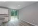 Open dining room showcasing wood floors and abundant light at 327 Larch Rd, Ocala, FL 34480