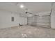 Spacious garage with cinder block walls and concrete floors at 327 Larch Rd, Ocala, FL 34480