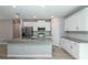 Contemporary kitchen with granite counters, stainless appliances, and ample white cabinets at 327 Larch Rd, Ocala, FL 34480