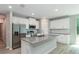 Modern kitchen with granite counters, stainless appliances, and white cabinetry at 327 Larch Rd, Ocala, FL 34480