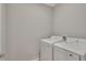 Bright laundry area equipped with a modern washer and dryer at 327 Larch Rd, Ocala, FL 34480