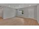 This living room features recessed lighting, neutral paint, a window, and wood-look floors at 327 Larch Rd, Ocala, FL 34480