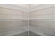 Walk-in pantry features white wire shelving for organization and storage at 327 Larch Rd, Ocala, FL 34480