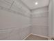 Walk-in closet with carpeted floors and white wire shelving for ample storage at 327 Larch Rd, Ocala, FL 34480
