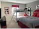 ' bedroom featuring a bunk bed, a full-size bed, and colorful Mickey Mouse themed decor at 456 Ocean Course Ave, Davenport, FL 33896